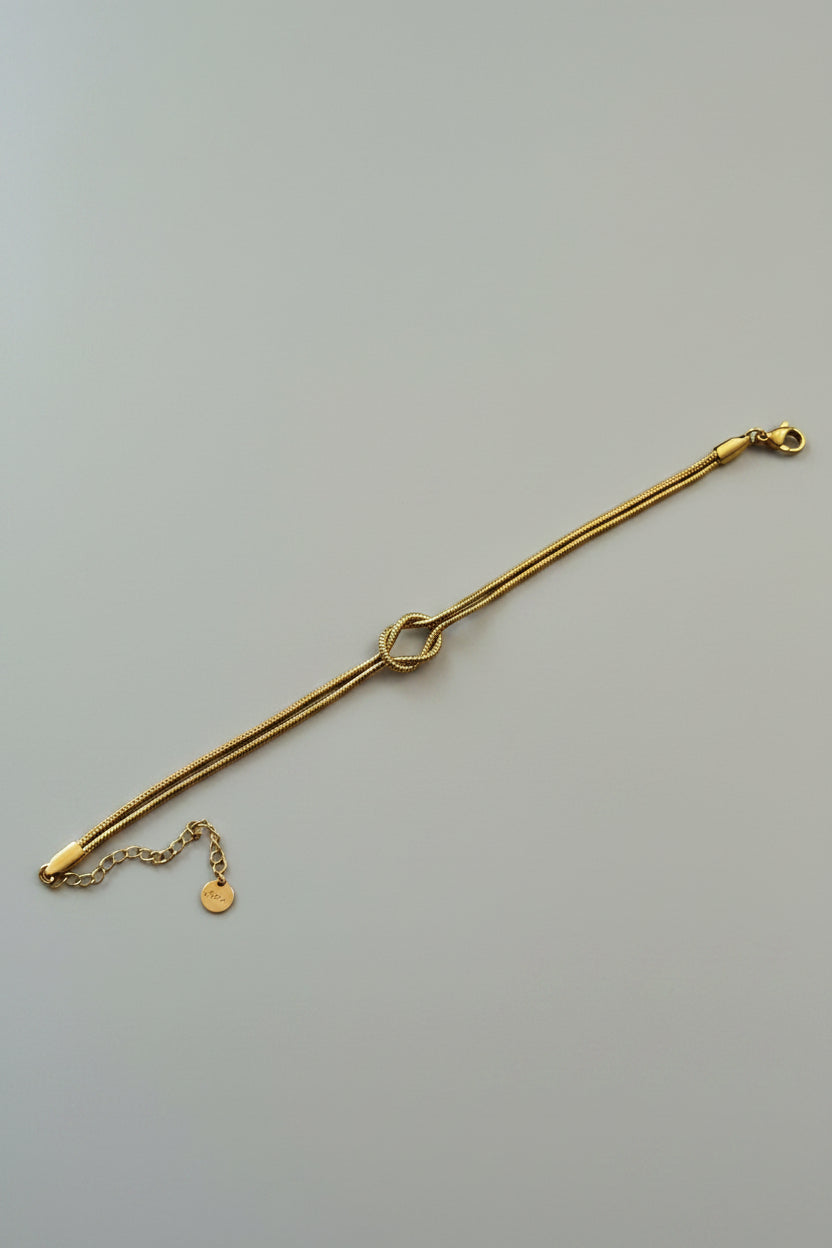 Bracciale a Cordino con Nodo di Giunzione in Acciaio Dorato