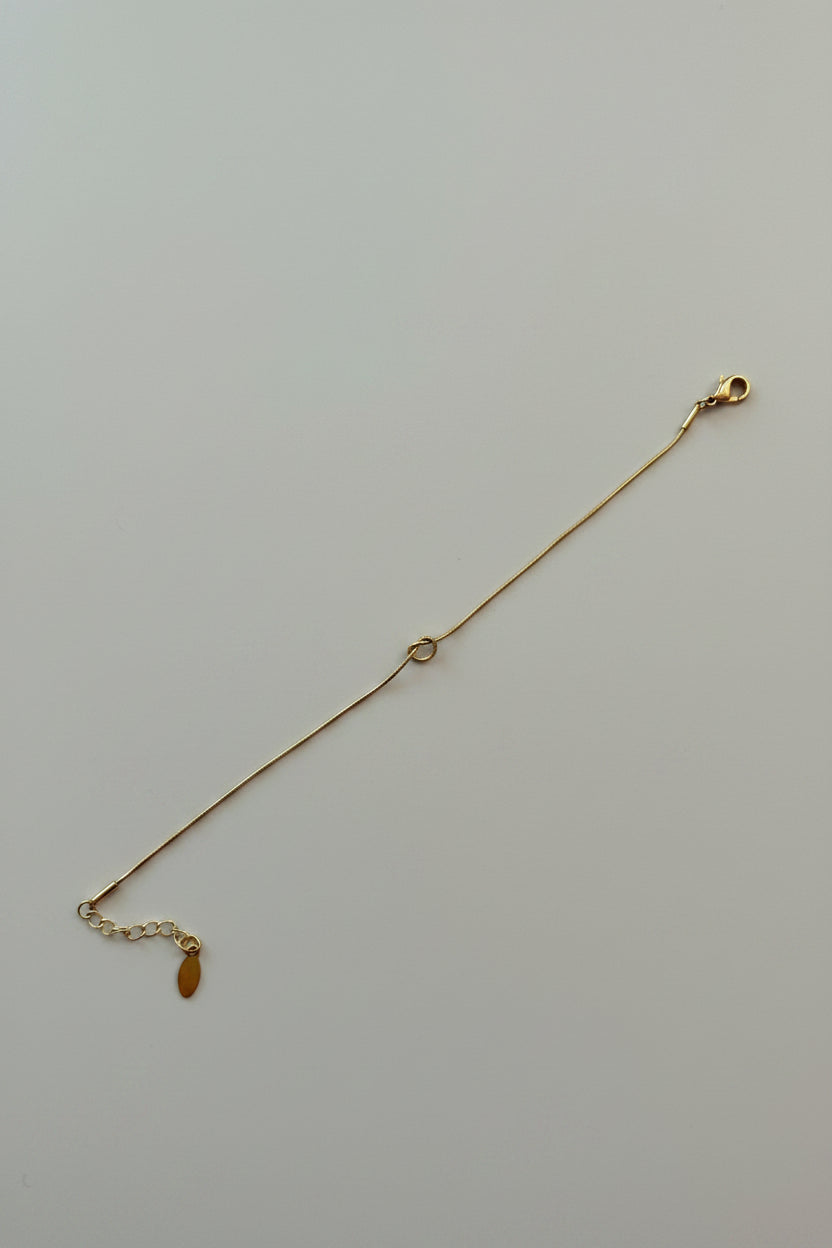 Bracciale Fine con Nodo in Acciaio Dorato