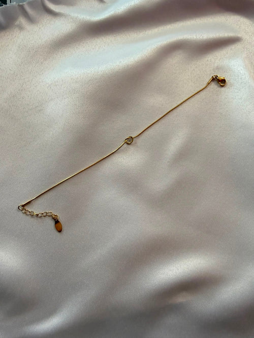 Bracciale Fine con Nodo in Acciaio Dorato