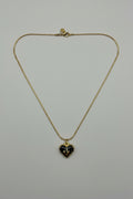 Nox Aurea — collana cuore nero smaltato con decoro dorato su catena snake oro