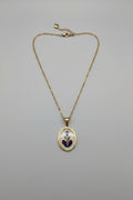 Collana medaglione con rosa su cuore spezzato