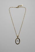 Collana medaglione ovale dorato con scritta NO COMMENT