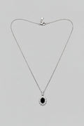 Nox Stellae — collana punto luce pietra ovale nera con brillantini in acciaio argento