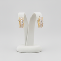 Lux Hoop — Orecchini a Cerchio con Cristalli Baguette sulla Parte Frontale in Acciaio Dorato